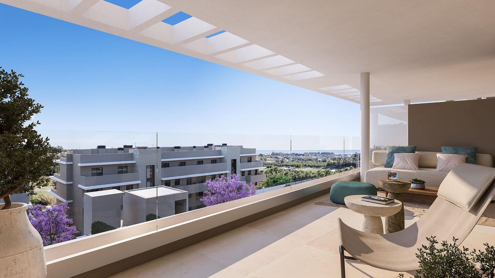Capri lejlighed terrasse med havudsigt og et afslappende loungeområde.